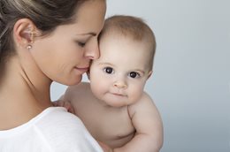 Snuggling a baby may help their genes and future health